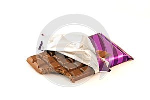 Chocolate bar with a missing bite over white