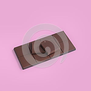 Chocolate bar on a pink background