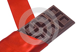 Chocolate bar and red silk