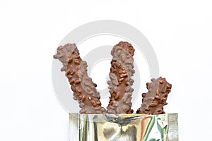 Chocolate bar snack package aluminum foil on white background