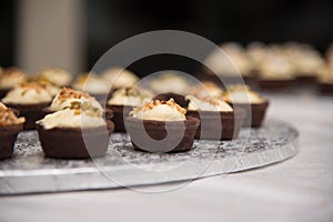 Chocolate basket with cream and hazelnuts