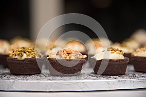 Chocolate basket with cream and hazelnuts