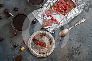 Chocolate with berries and pistachios, top view