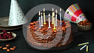 Chocolate birthday cake with candles. Party cake. Light candles. Make a wish. Happy birthday concept. Chocolate cake. Birthday par