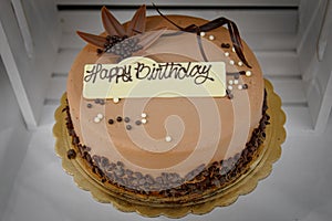 Chocolate birthday cake with Happy Birthday Sign