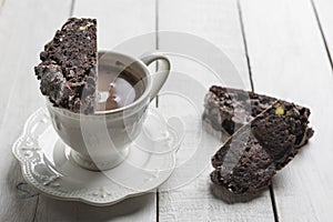 Chocolate Biscotti or Cantuccini over a cup of chocolate.