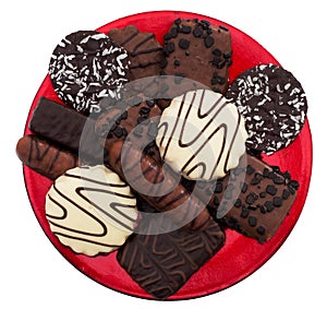 Chocolate biscuit asortment isolated on red plate