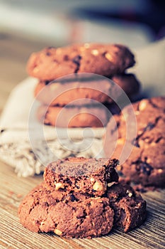 Chocolate biscuit cookies. Chocolate cookies on white linen napkin on wooden table