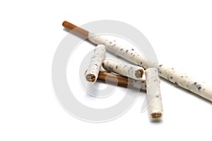 Chocolate biscuit stick coated with milk flavour confectionery and crushed cookies and cream taste isolated on white background