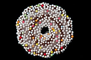 Chocolate biscuits rings on black background