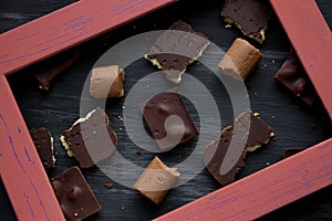 Chocolate on black the old table