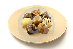 Chocolate bonbons on plate