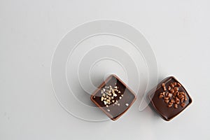 Chocolate bonbons on a white surface