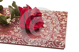 Chocolate box and red rose