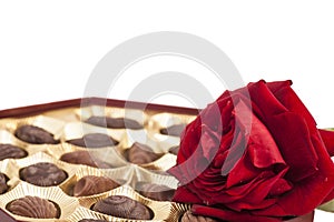 Chocolate box and red rose