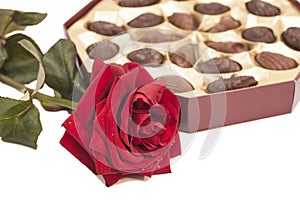 Chocolate box and red rose