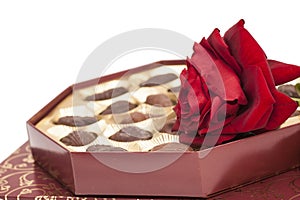 Chocolate box and red rose