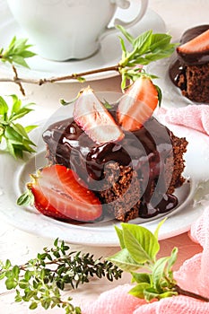 Chocolate brownie cake with fresh strawberries