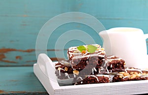 Chocolate brownie cake with nuts and ising