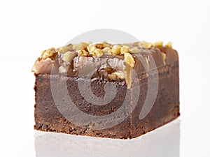 Chocolate brownie cake piece isolated on white.