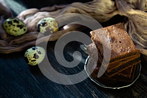 Chocolate brownie on quail eggs