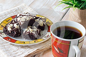 Chocolate brownies cake and cup of coffee