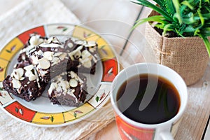 Chocolate brownies cake and cup of coffee