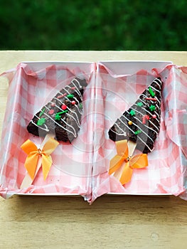 Chocolate brownies in shape of Christmas tree with festive sprinkle top view