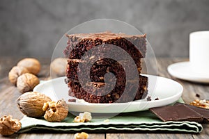 Chocolate brownies with walnuts on a stack