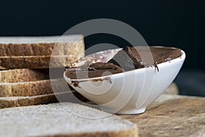 Chocolate butter spread on bread while cooking breakfast