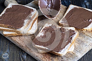 Chocolate butter spread on bread while cooking breakfast