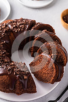 Chocolate cake baked in a bundt pan with chocolate ganache glaze