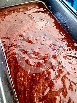 Chocolate cake batter in pan before baking