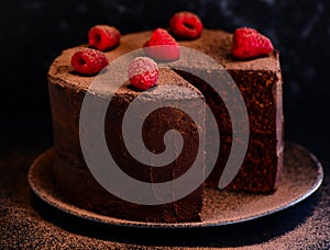Chocolate cake with berries and ganache photo
