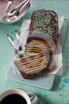 Chocolate cake with biscuits and topping