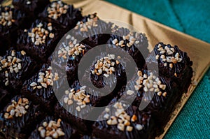 Chocolate Cake Brownie Squares Drizzled With Chocolate Nutella and Walnuts.