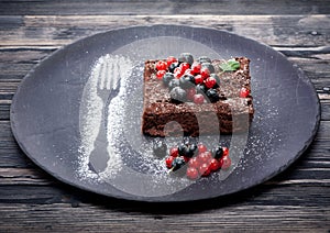 Chocolate cake brownie with summer berries