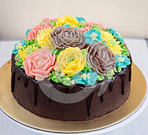 Chocolate cake with buttercream flowers photo