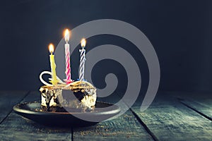 Chocolate cake with a candle and gifts.Happy Birthday, card. Holidays greeting card.