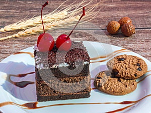 chocolate cake with cherry and chocochip