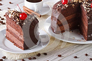 Chocolate cake with cherry and a piece. Horizontal
