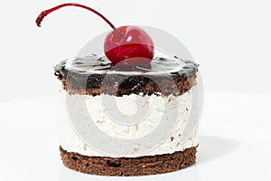 Chocolate cake with cherry on the top icing