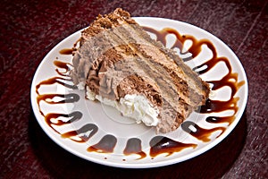 Chocolate cake with a creamy cream photo