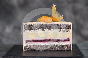 Chocolate cake on a dark background adorned with citrus