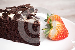 Chocolate cake decorate with whipping cream, sliced chocolate an