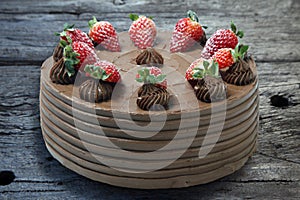 Chocolate cake decorated with strawberries