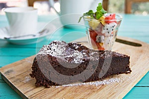 Chocolate cake with fruits salad