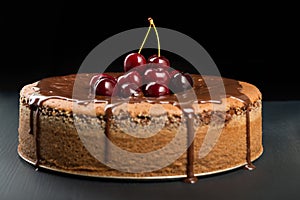 Chocolate cake with juicy cherries