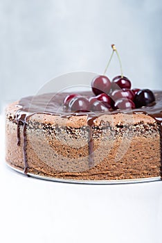 Chocolate cake with juicy cherries