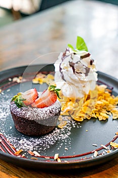 chocolate cake lava with strawberry and vanilla ice-cream